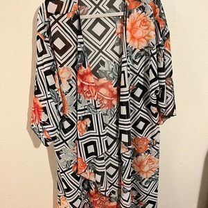 Black and white with coral roses and sage leaves